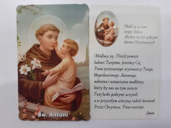 Święty Antoni z Dzieciątkiem Jezus, otoczony kwiatami lilii. Obok tekst modlitwy do świętego Antoniego.